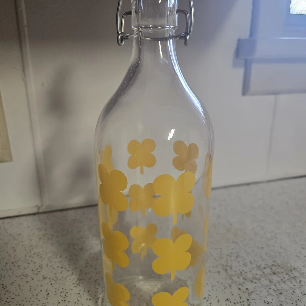 IKEA Clear Glass Jar with Yellow Floral Accents